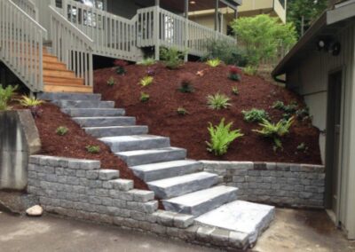 stone steps and terrances stone pavers with mulched area and plantings.